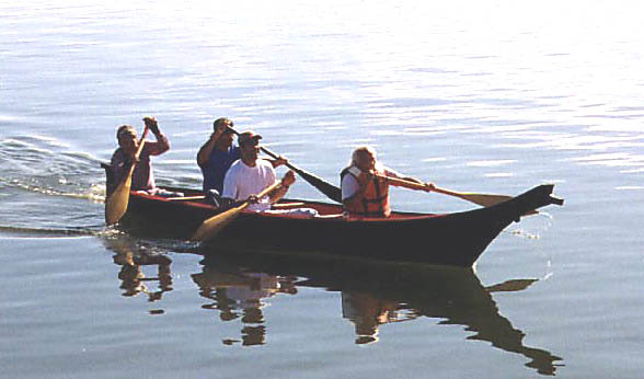 A photo of a taped-seam plywood replica Coquille dugout canoe