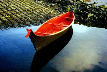 photo of a taped-seam plywood replica Quileute dugout canoe.